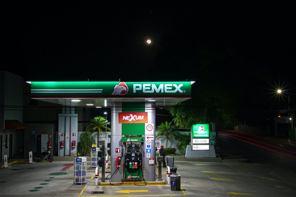green and white gas station