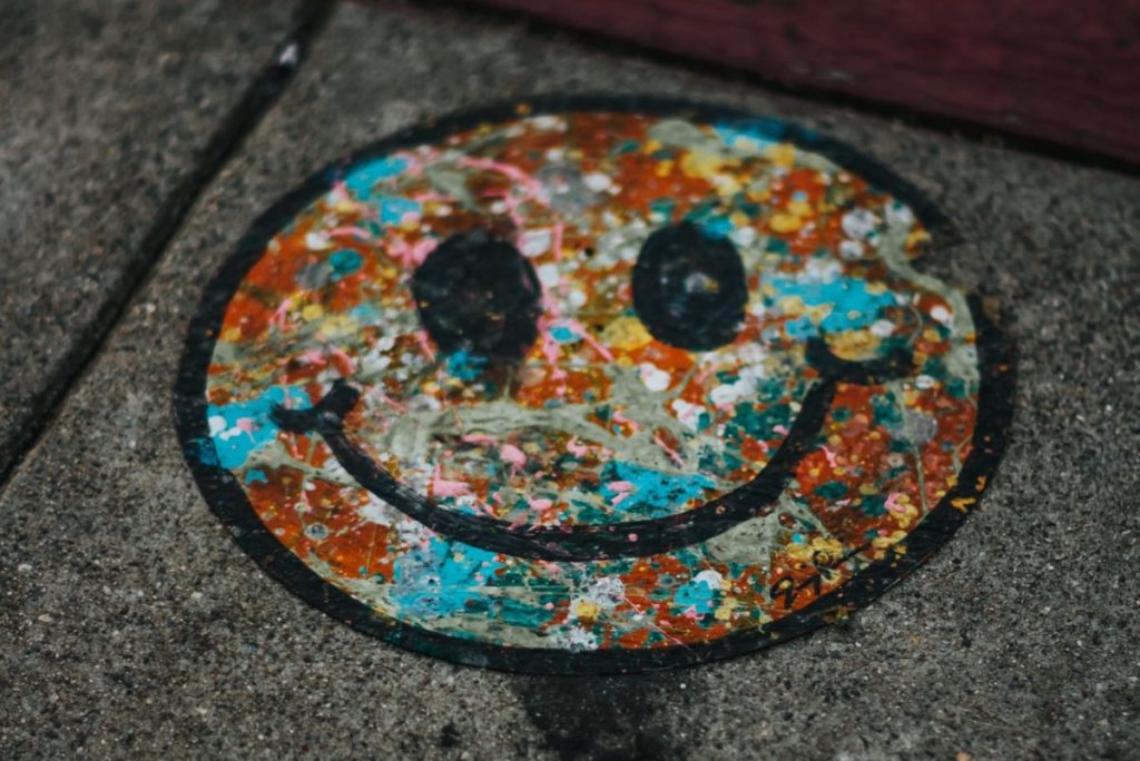 round brown and teal smiley print